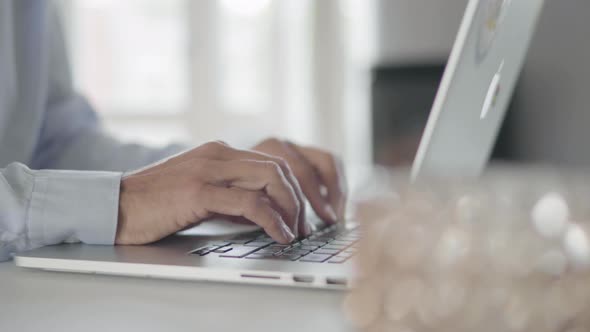Businessman using laptop alt