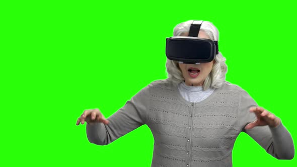 Old Woman Wearing Virtual Reality Headset alt