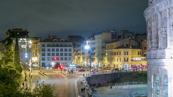 View of Square Near Colosseum Illuminated at Night Timelapse in Rome, Italy alt