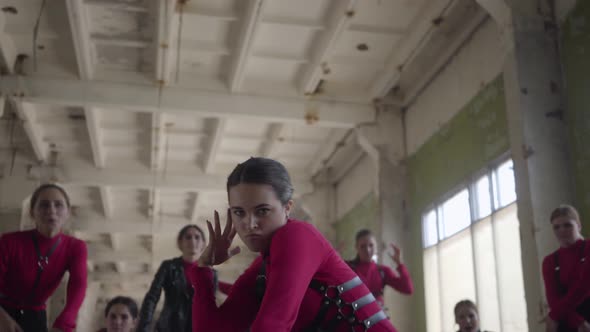 Contemporary Dancing Band of Young Girls and Guys in Same Stage Costumes Emotionally Performing alt