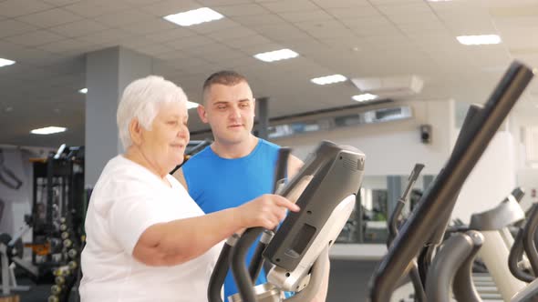 Happy Smiling People Are Engaged In Physical Education Simulators In Gym By Vailery 0125