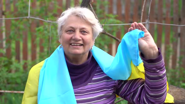 Elderly Woman with the Flag of Ukraine