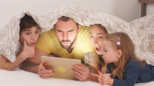 Beautiful Family Enjoy Spending Time Together at Home alt
