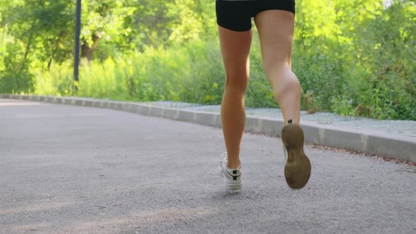 Slow Motion Female Legs Running on Road, Stock Footage | VideoHive