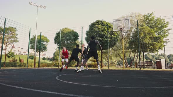 Basketball Team Trains on the Court alt