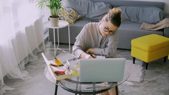 Woman Studying Online at Home Draw at Table