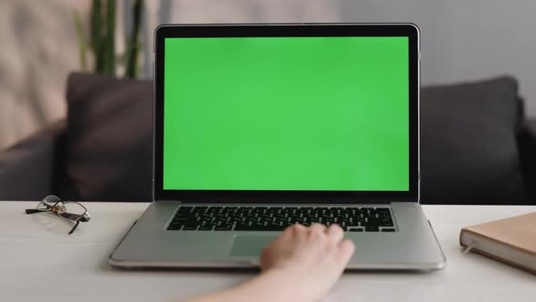 Woman Hand Typing on Laptop With Green Screen Chroma Key at The Office Table