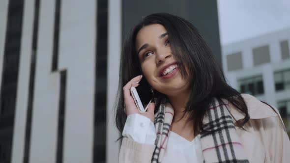 Businesswoman Talking Mobile Phone Outdoors. Business Lady Using Cellphone alt