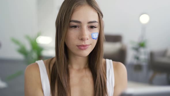 Portrait of Young Attractive Woman Holding Phone and Tablet in Hands and Smiling Looking alt
