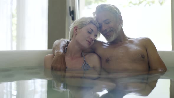 Couple relaxing in Jacuzzi
