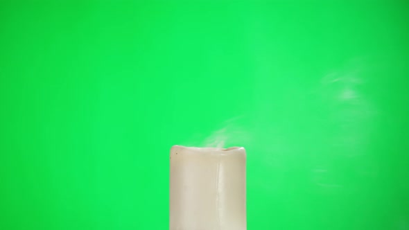 Burning Wax Candle on Green Chroma Key Background alt