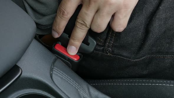 Unlocking of 3-point seat safety belt slow-mo video alt