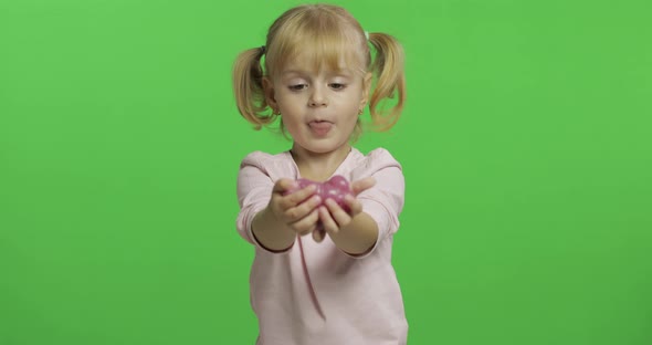 Kid Playing with Hand Made Toy Slime. Child Having Fun Making Pink Slime alt