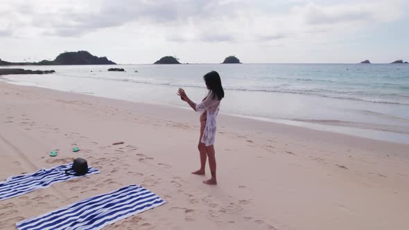 Young Woman In Bikini Taking Selfie With Smartphone alt