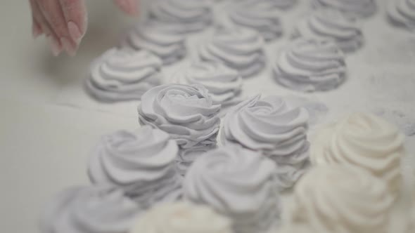 Woman's Hand Placing Confectionery on the Table in Slow Motion alt