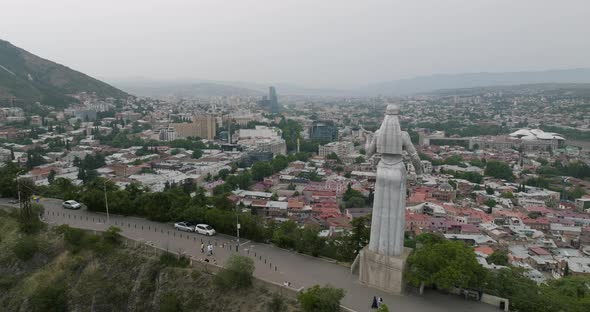 Panorama of the Tbilisi and the back of Kartlis Deda statue during daytime. alt