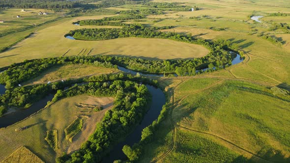 Countryside. A Wide Canal That Flows Between Fields And Forests. Wide Length Of The River