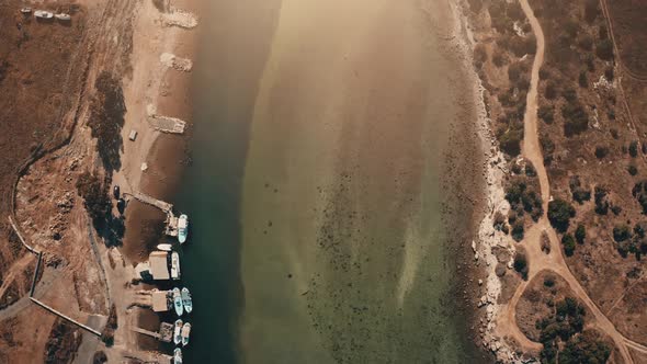 Aerial Topdown Sunset River Bank in Desert Nature Landscape