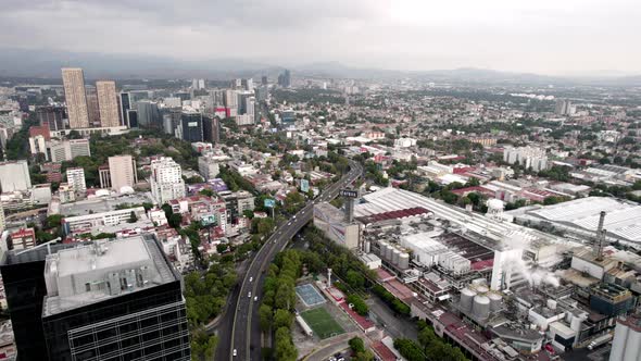 drone shot of a beer factory in the industrial heart of mexico city alt