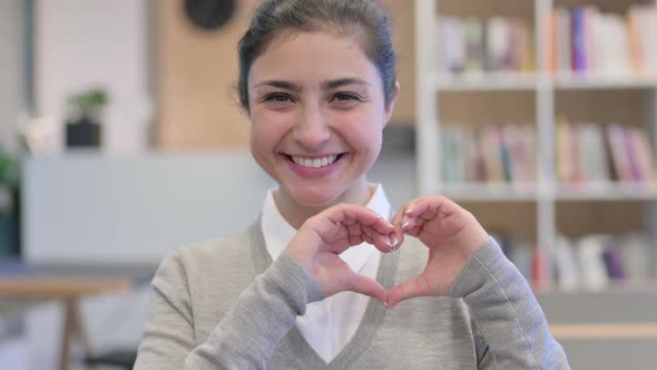 Beautiful Indian Woman Shows Heart Sign By Hand  alt