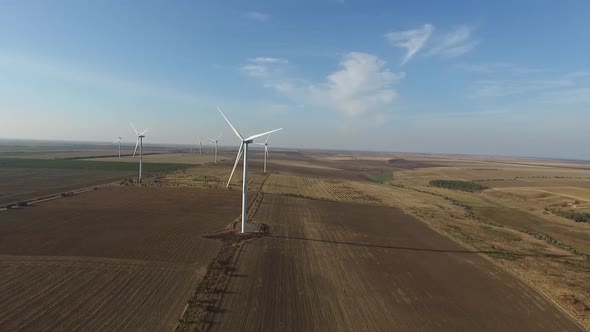 Rotating Turbines of a Wind Farm. Renewable Energy. Aerial alt
