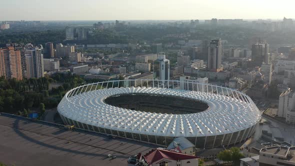 Aerial drone video of downtown skyline buildings in Kyiv Oblast Ukraine during sunset. Overlooking O alt