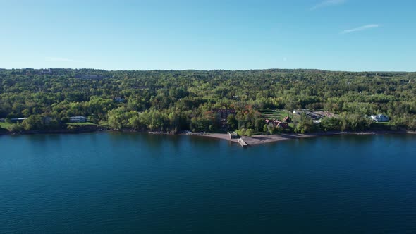 Drone aerial view of Lake Superior shoreline in front of Glensheen Mansion alt