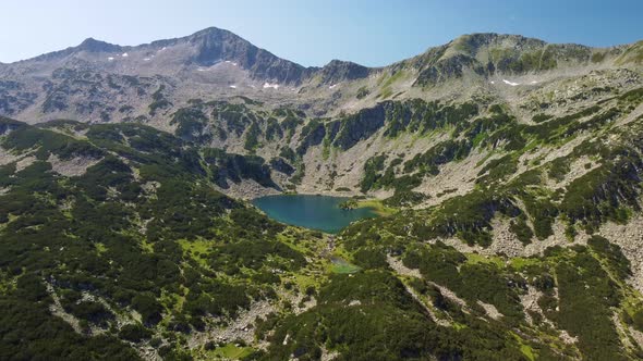 Aerial View of a Lake in the Pirin Mountains with Blue Clear Water alt