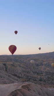 Vertical Video of Hot Air Balloons Flying in the Sky Over Cappadocia Turkey alt