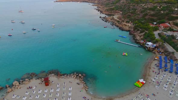 Drone views of world famous Konnos Beach in Mediterranean island of Cyprus late afternoon after suns alt