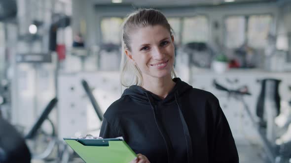 Portrait of female fitness instructor at the gym.  Shot with RED helium camera in 8K alt