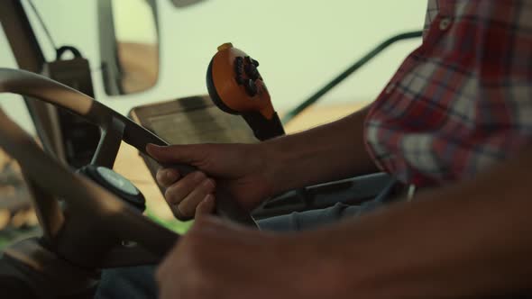 Farmer Hand Combine Wheel at Countryside Close Up alt