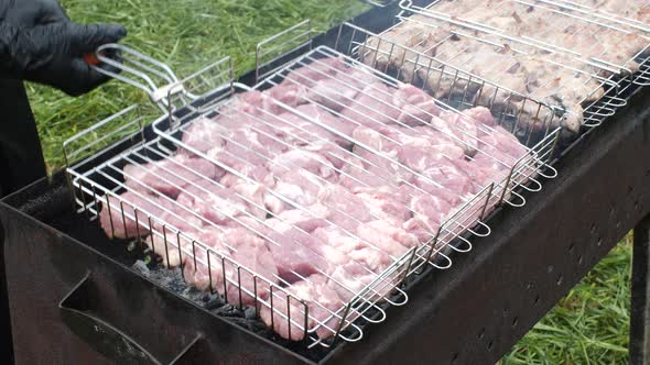 Cook in Gloves Preparing Shish Kebab on Grill