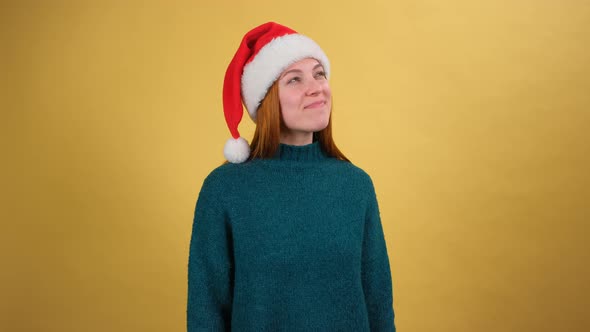Dreamful Happy Charming Young Woman in Cozy Sweater Santa Christmas Hat