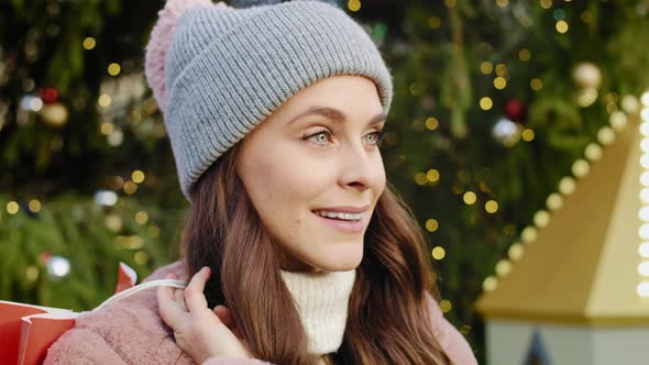 Portrait video of woman with chopping bag in winter. Shot with RED helium camera in 8K alt
