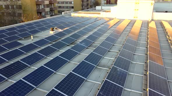Solar power panels on top of residential building roof for producing of green ecological electricity alt