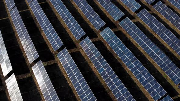 Solar Power Station, Solar Panels Stand in a Row in the Fields, Green Energy and Electrics