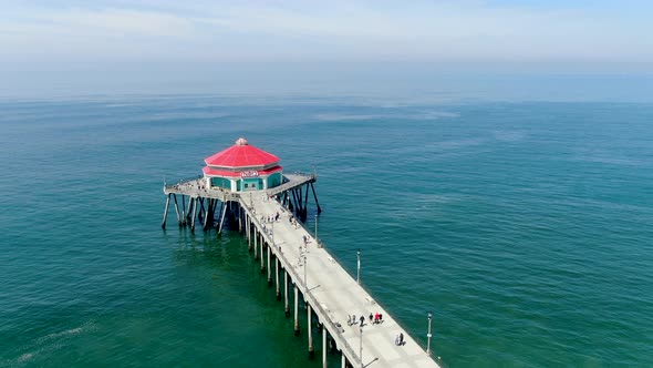 Aerial View of Huntington Pier, Beach and Coastline During Sunny Summer Day alt