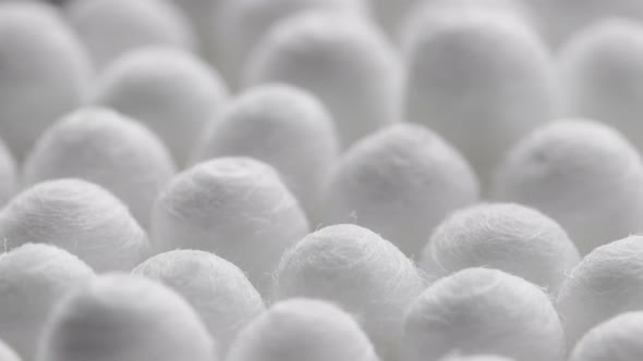 Closeup Spinning Fullframe Macro Background of Cotton Earbud Heads alt