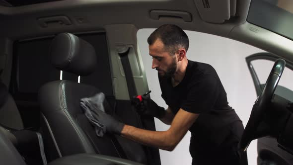 Dry Cleaning The Car Interior A Man Applies Foam To Treat Leather Seat Of By Volodymyrfelbaba Dry Cleaning The Car Interior A Man, Dry Foam Car Seat Cleaner