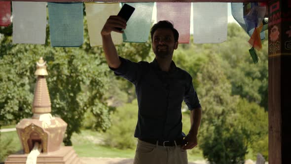 Guy Smile Relaxing And Enjoying On Vacation. Selfie On Mobile Phone For Social Networks. alt