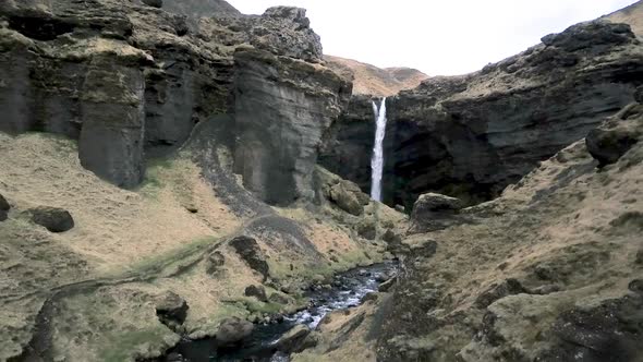 Kvernufoss Waterfall Iceland Drone with river green moss and birds alt
