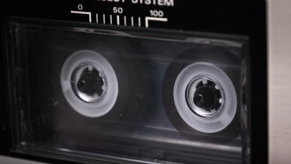 Audiocassette Rotates in Vintage Tape Recorder alt