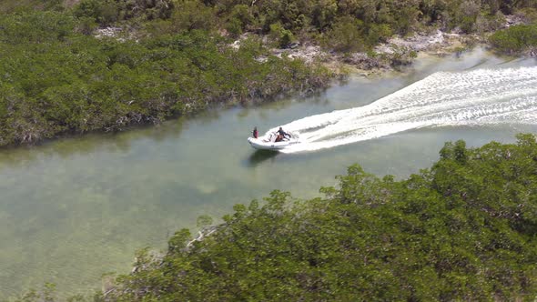 Motorboat On Speed Running Through Waters Passing With Lush Mangroves At Bahama Islands, Florida. - alt