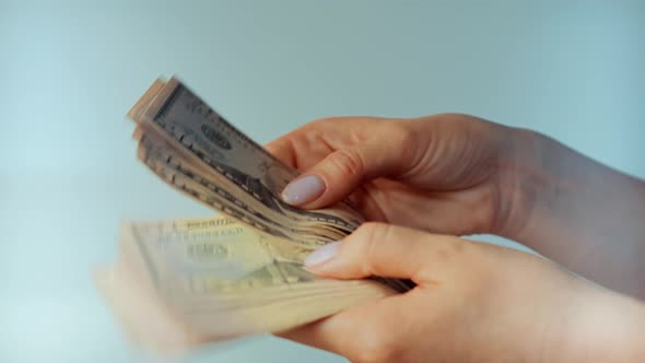 Hands Counting Currency US Dollar Bills. Calculating Home Expenses And Taxes. Family Budget. alt