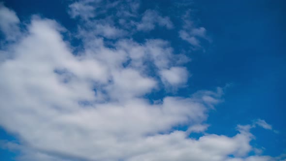 Clouds Move Smoothly in the Blue Sky. Timelapse alt