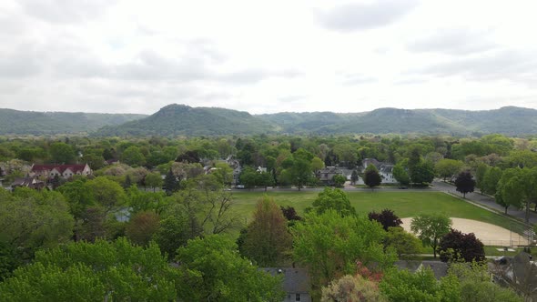 Residential neighborhood with older homes surrounding a well maintained park.