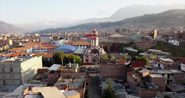 an aerial shot of a catholic church in peru alt