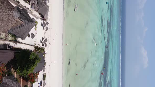 Vertical Video of the Beach on Zanzibar Island Tanzania Aerial View alt