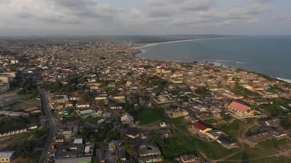 Aerial view of the old fishing town of Winneba, Ghana, Africa. 4K alt